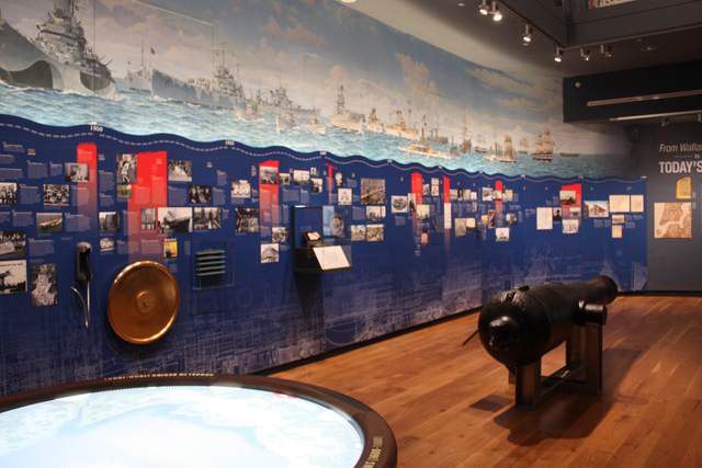 The first exhibit 'From Wallabout Bay to Today's Yard Today' features an incredible handpainted mural by one of the Navy Yard's tenants and a wall to wall timeline.